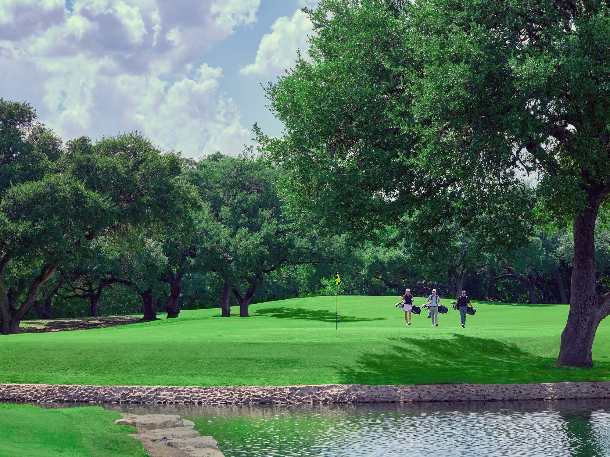 Dominion CC_LS Golfers walking 18th face on 10056a