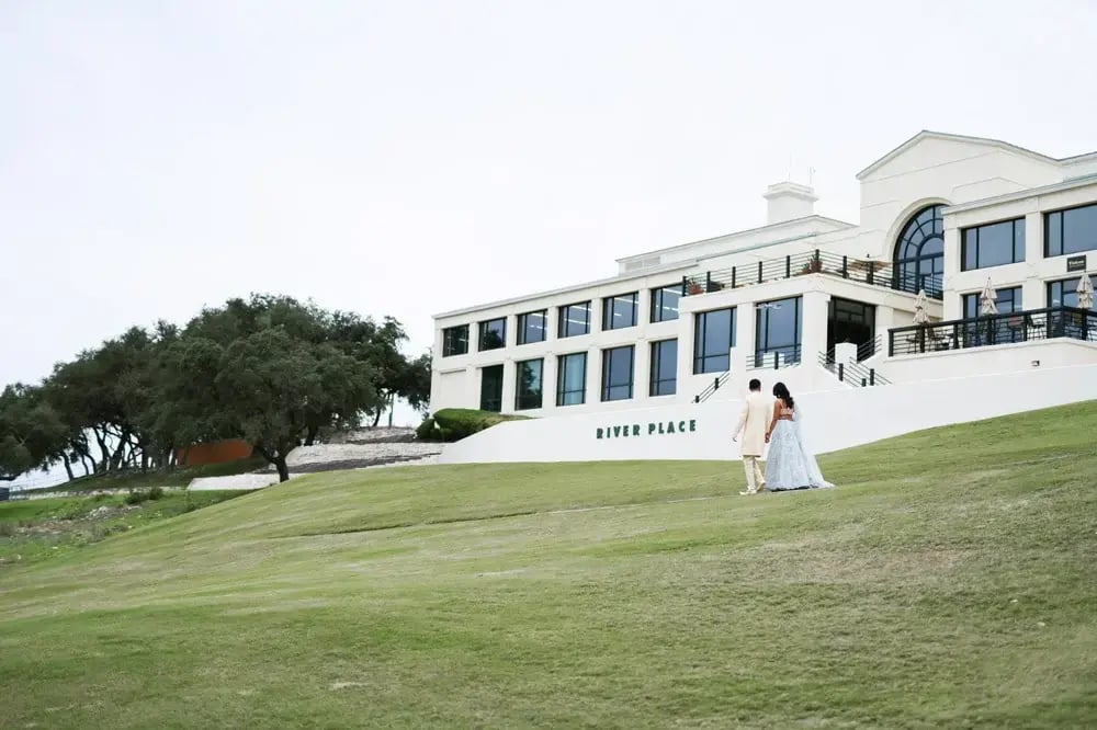 River Place Wedding Couple Walking by Clubhouse