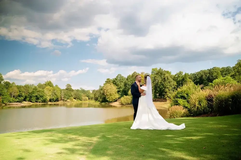 Manor wedding couple by lake