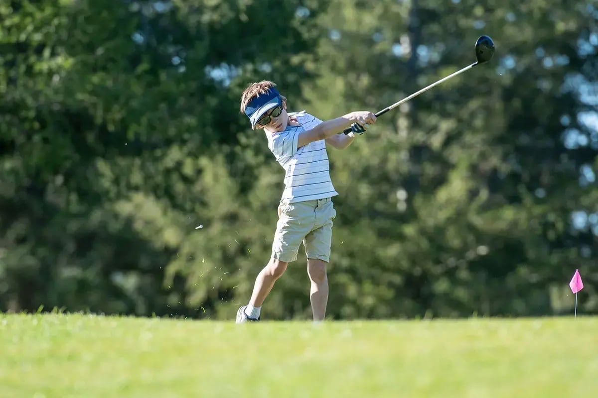 Junior golfer swing