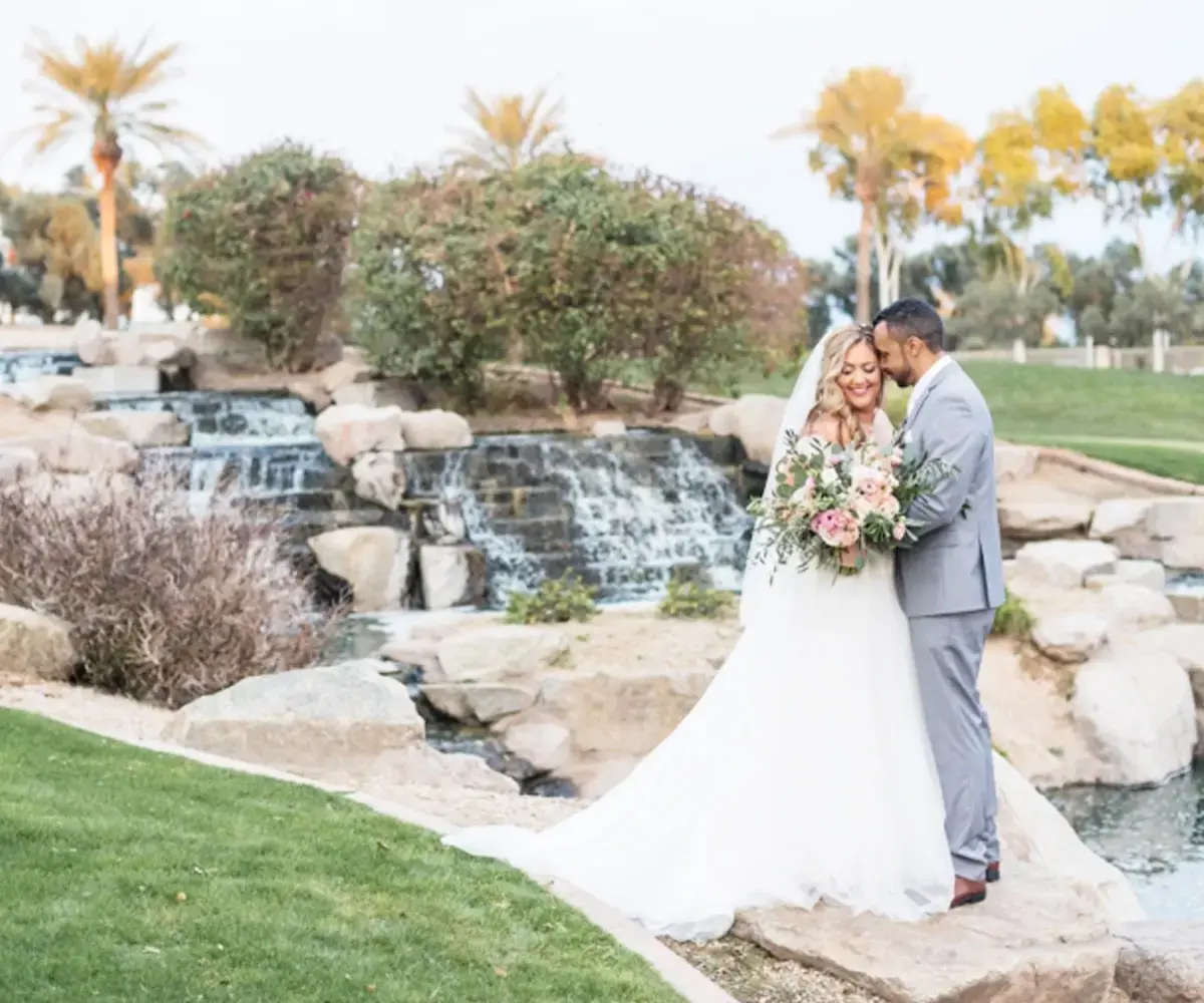 couple by the water on the course